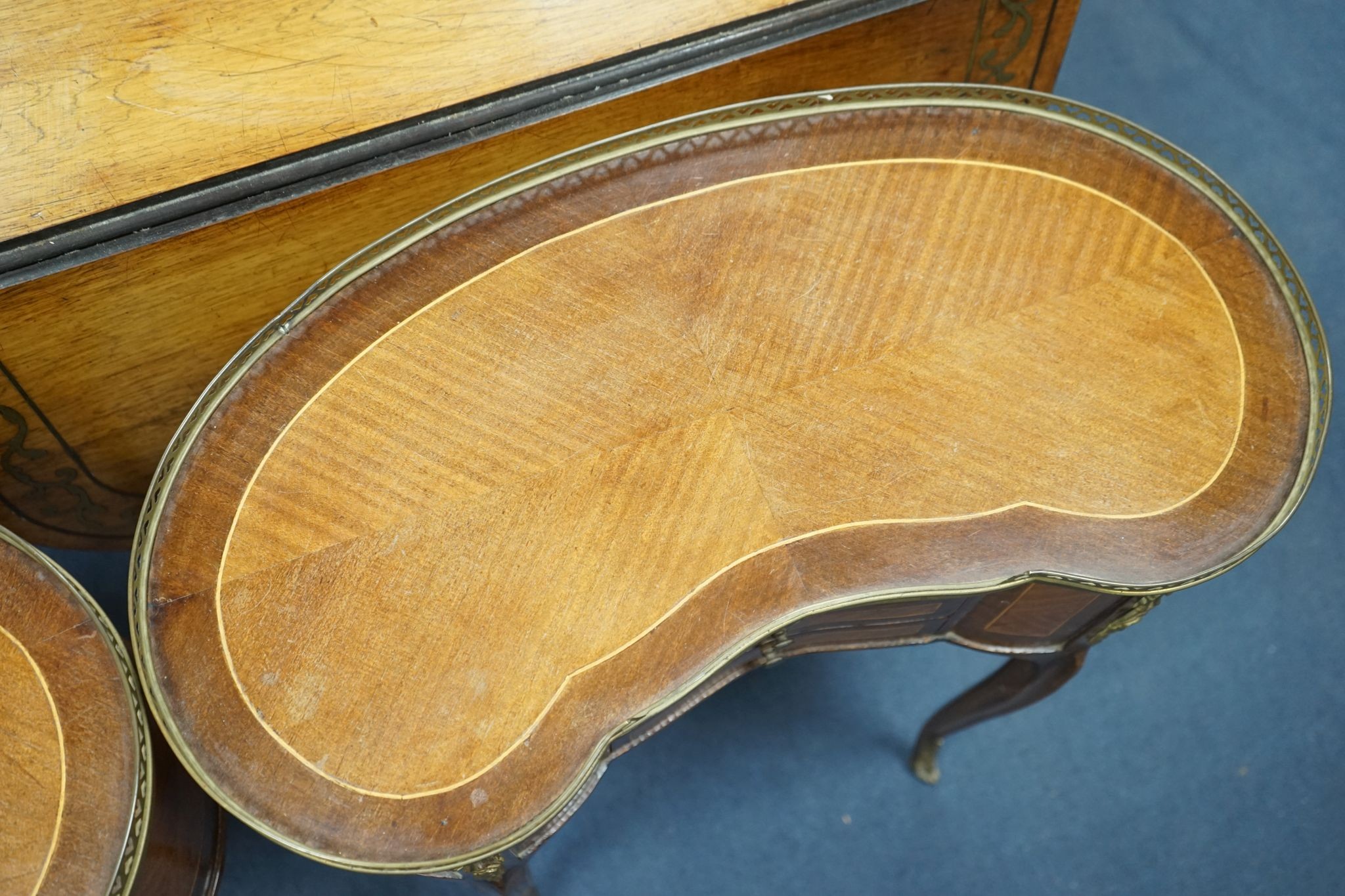 A pair of Louis XV design galleried kidney shaped occasional tables, width 59cm, depth 29cm, height 71cm